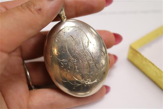 Two Victorian engraved silver lockets and an ornate Indian white metal locket, largest 50mm.